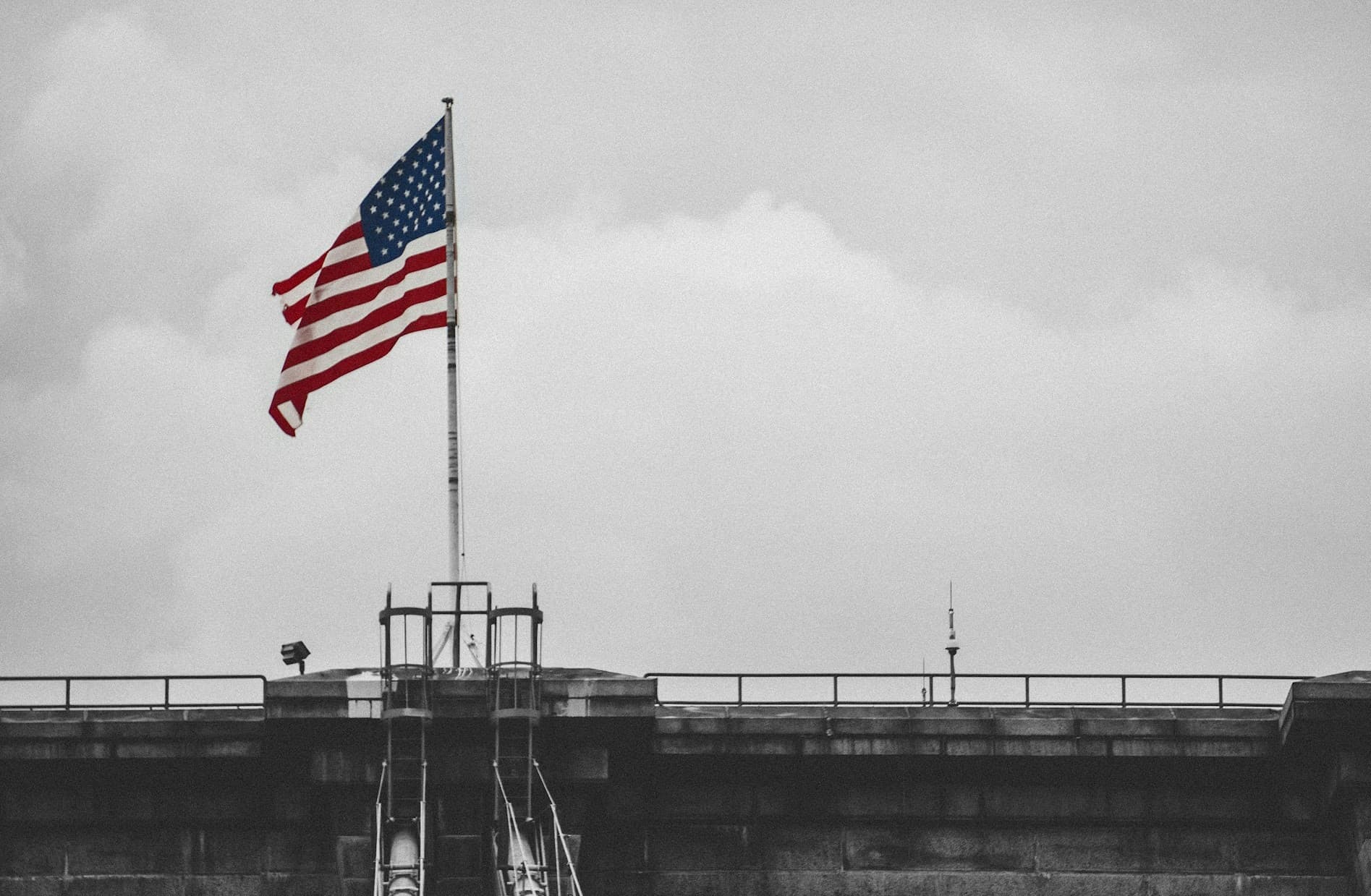 American flag on a bridge. 