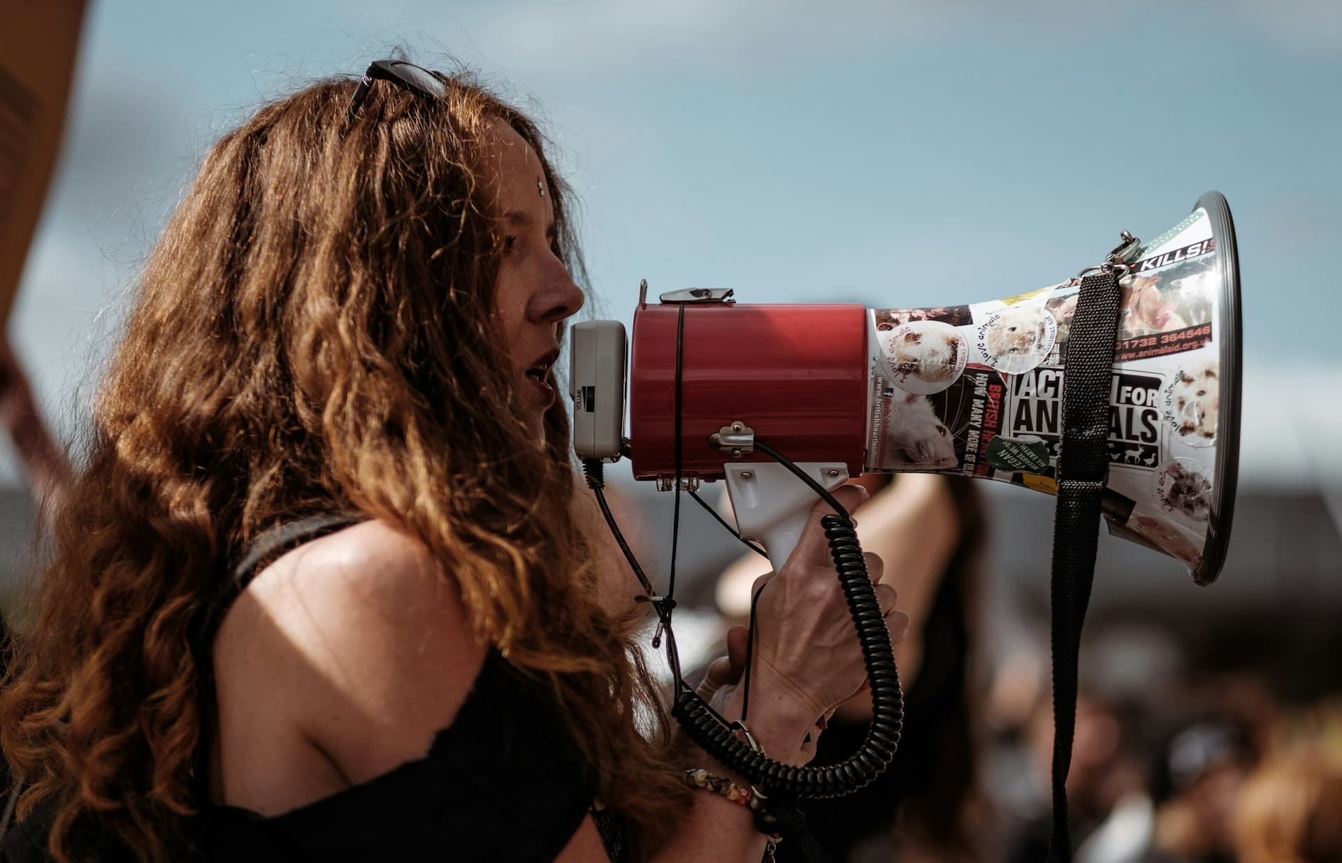 Woman with a megaphone at a rally. 