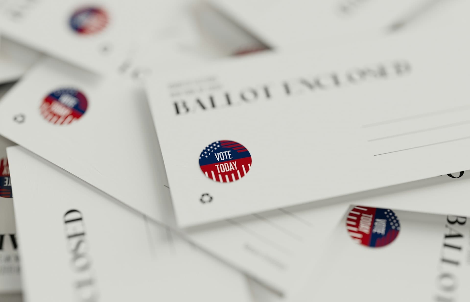 Stack of mail ballots.