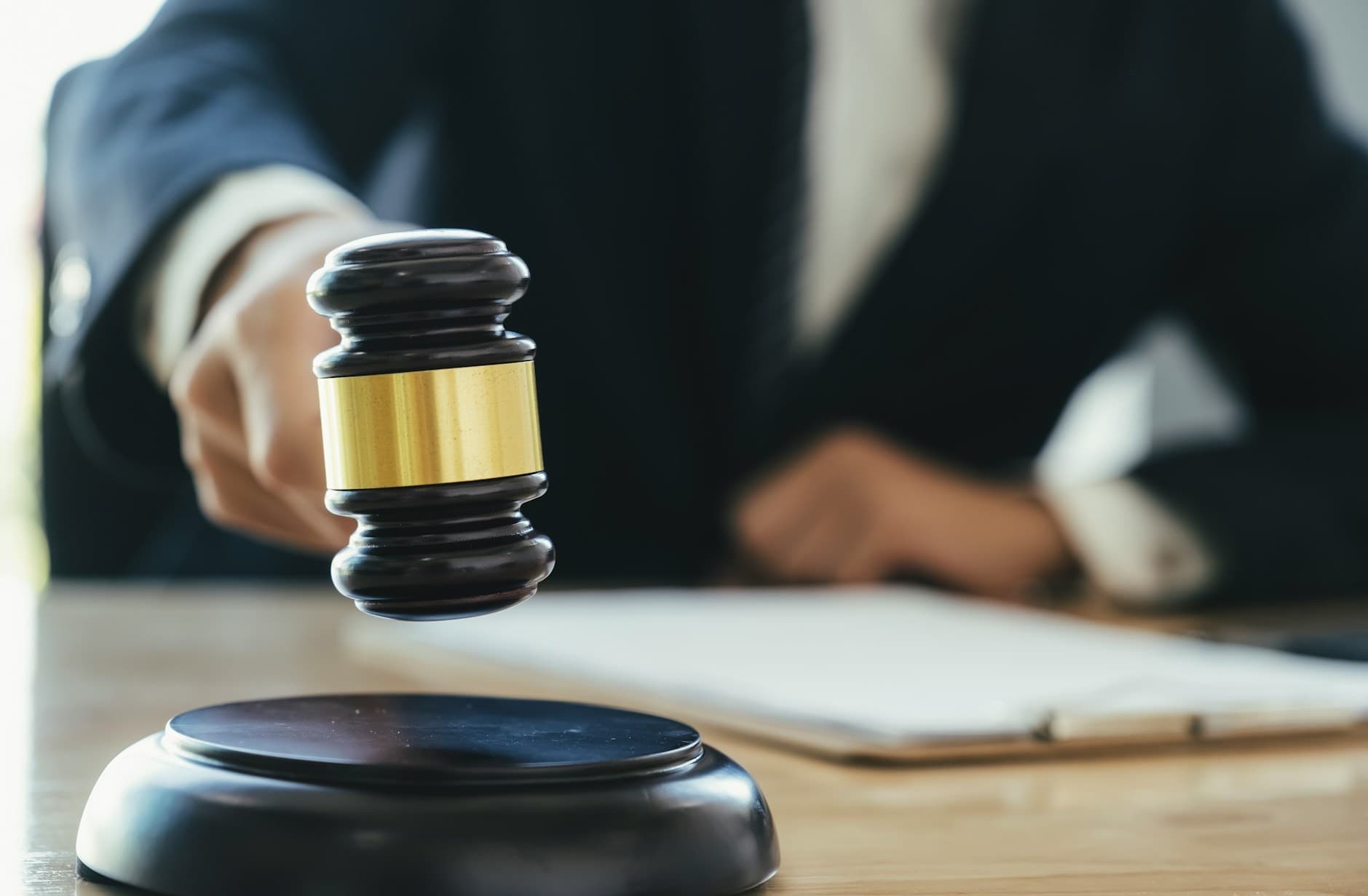 Judge about to slower gavel. 