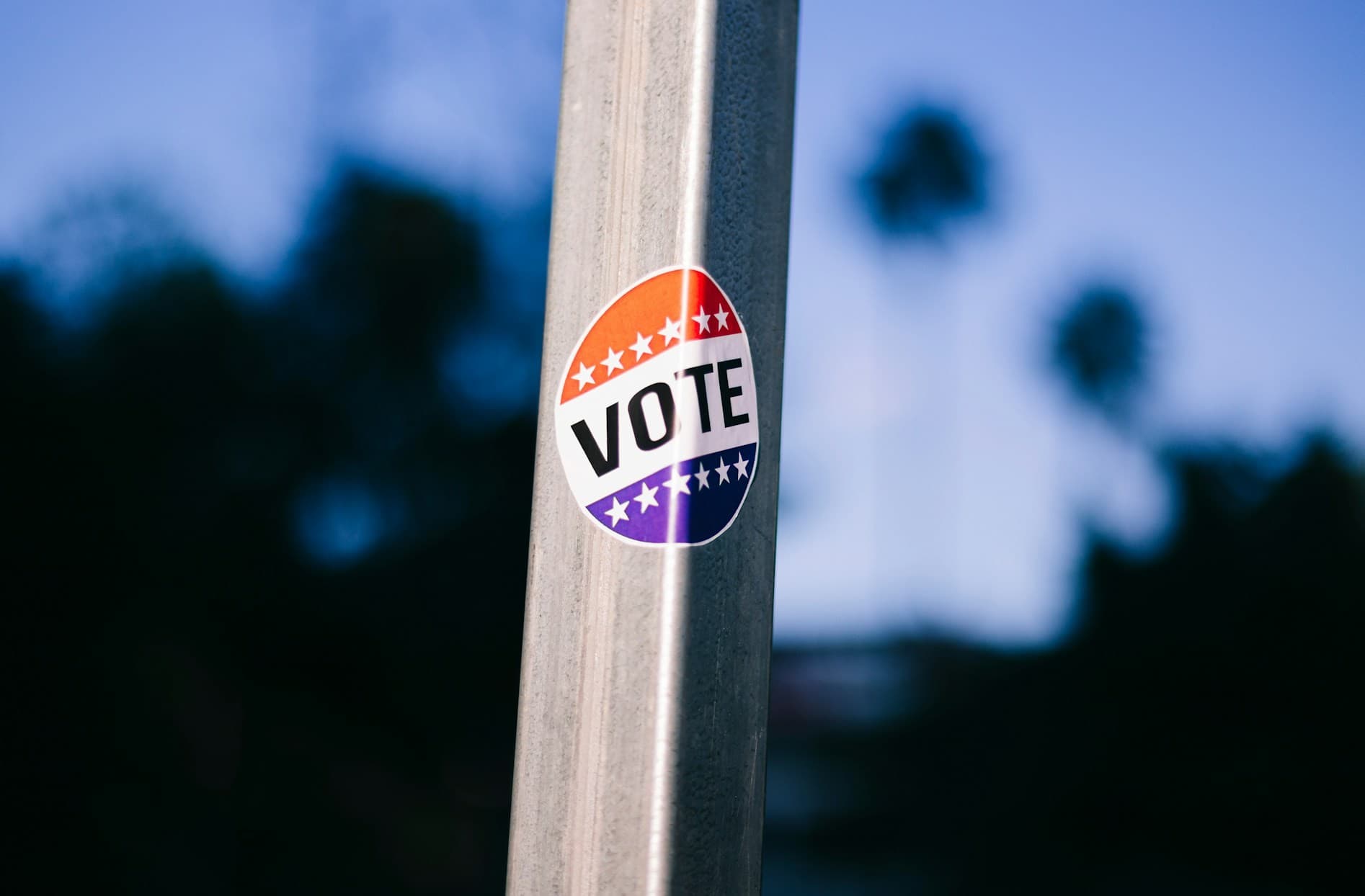 Vote sticker on a pole. 
