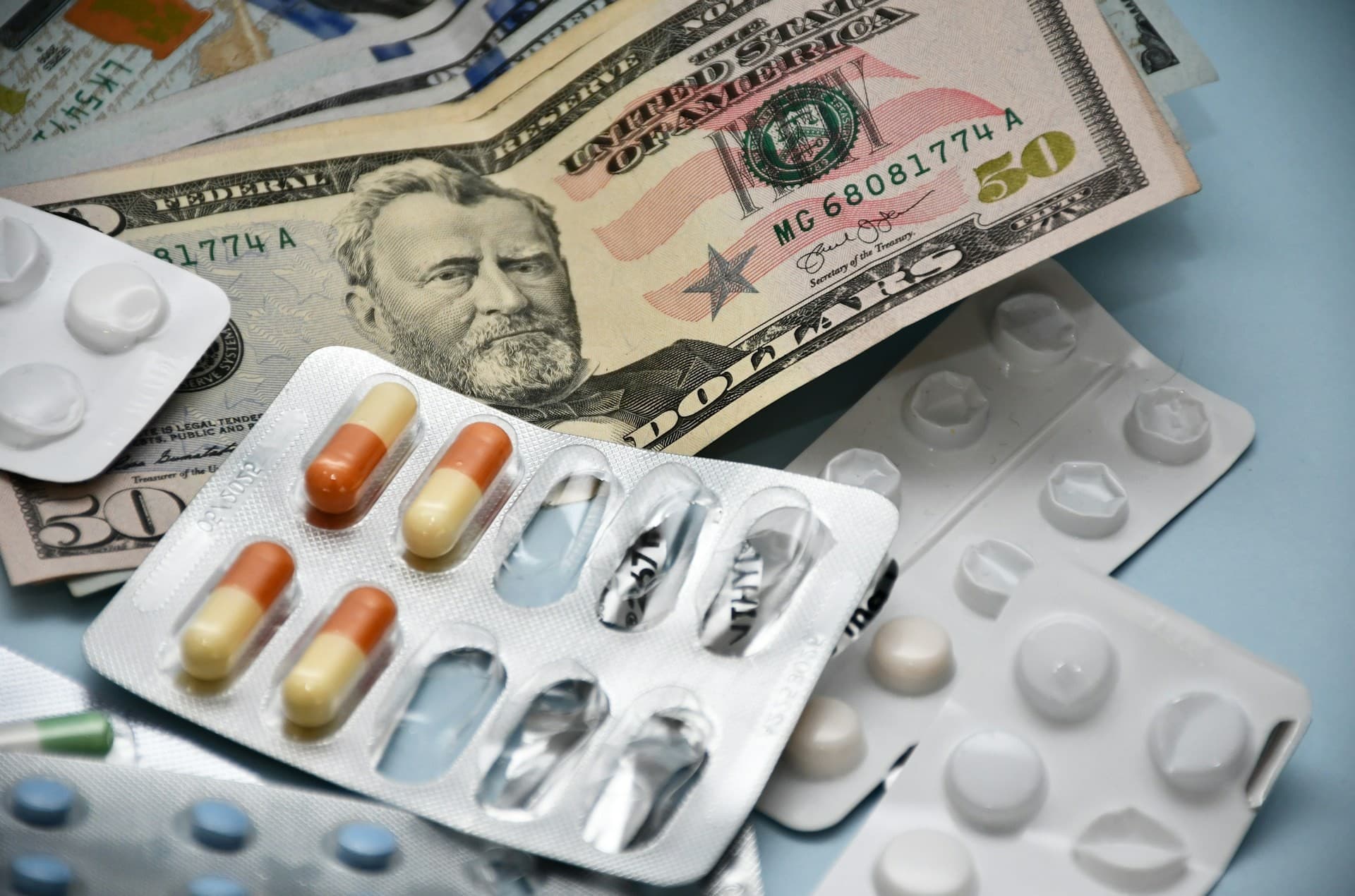 Medicine tablets next 50 dollar bills. 
