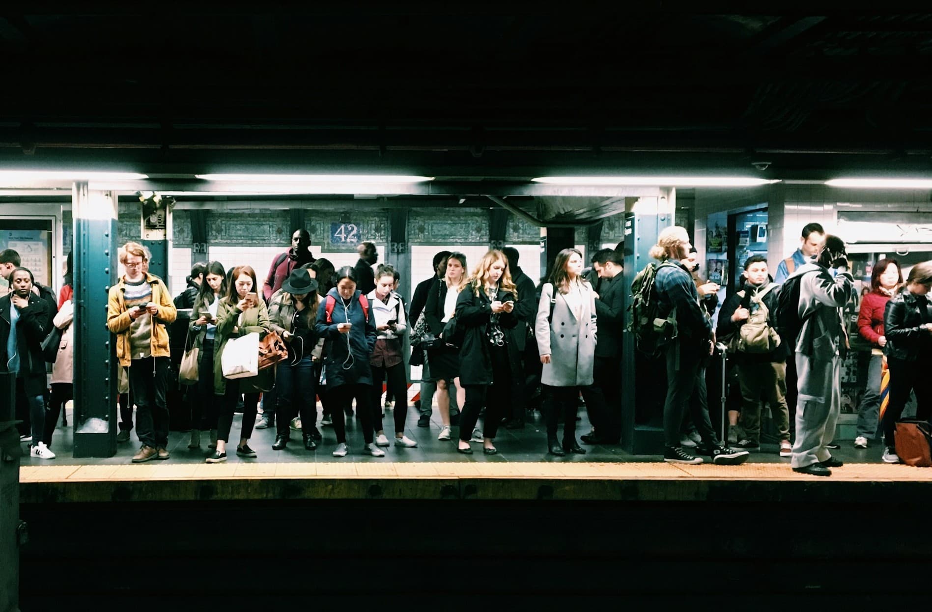 New Yorkers waiting in the subway.