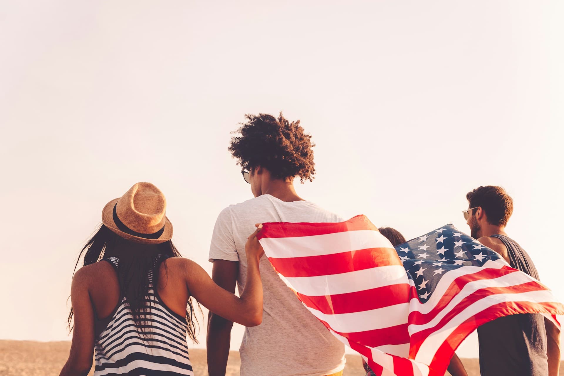 Young people with an American flag. 