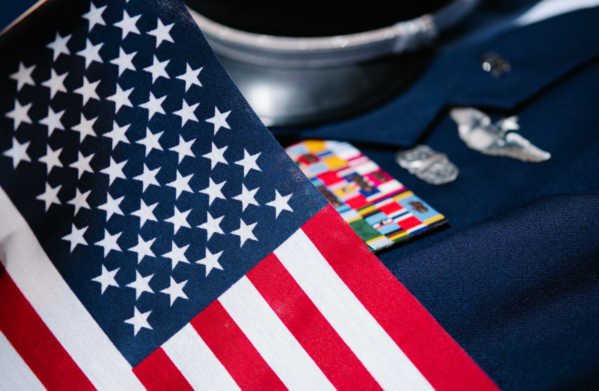 Military uniform with an American flag over it. 