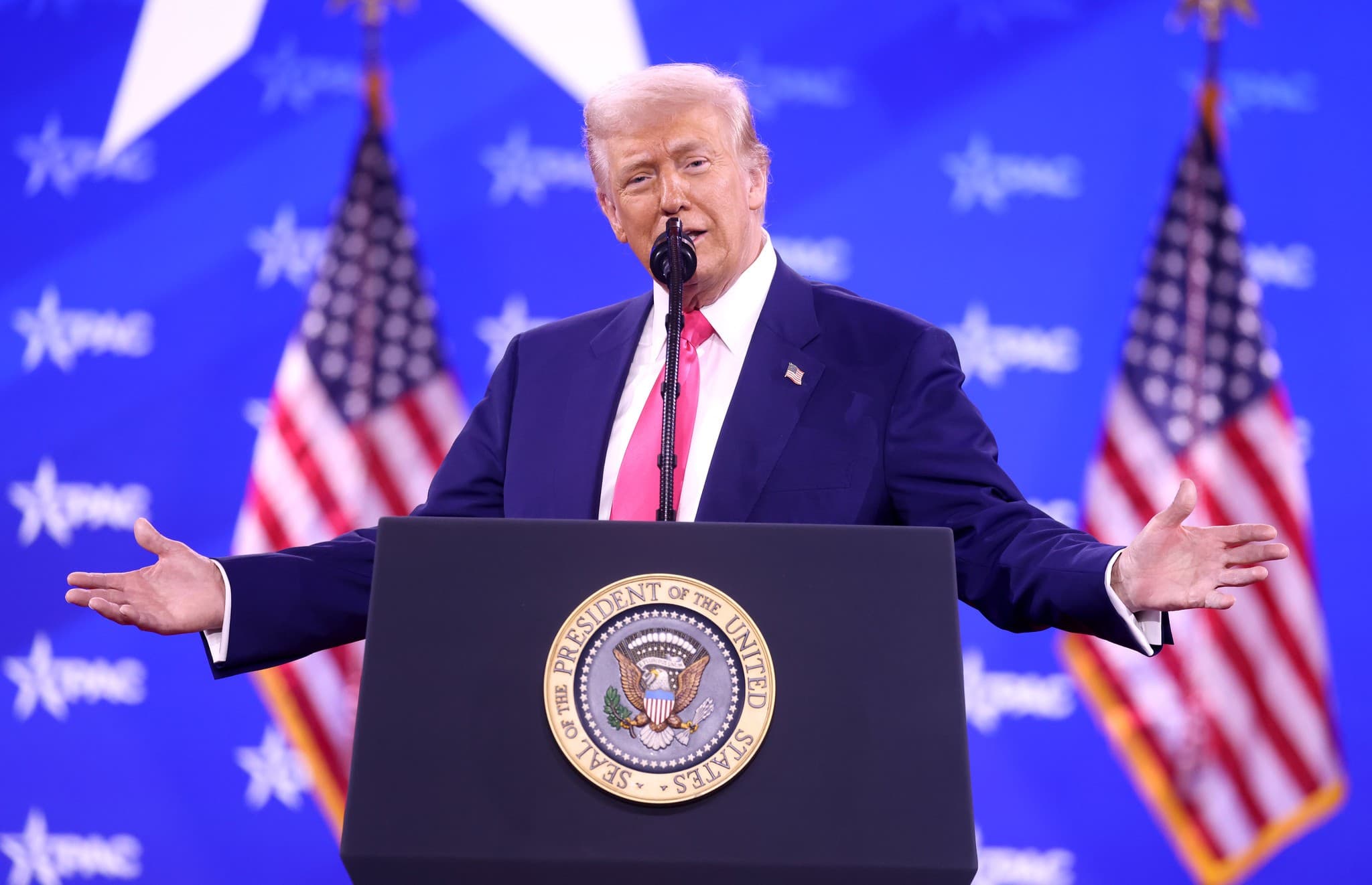 Donald Trump at podium. 