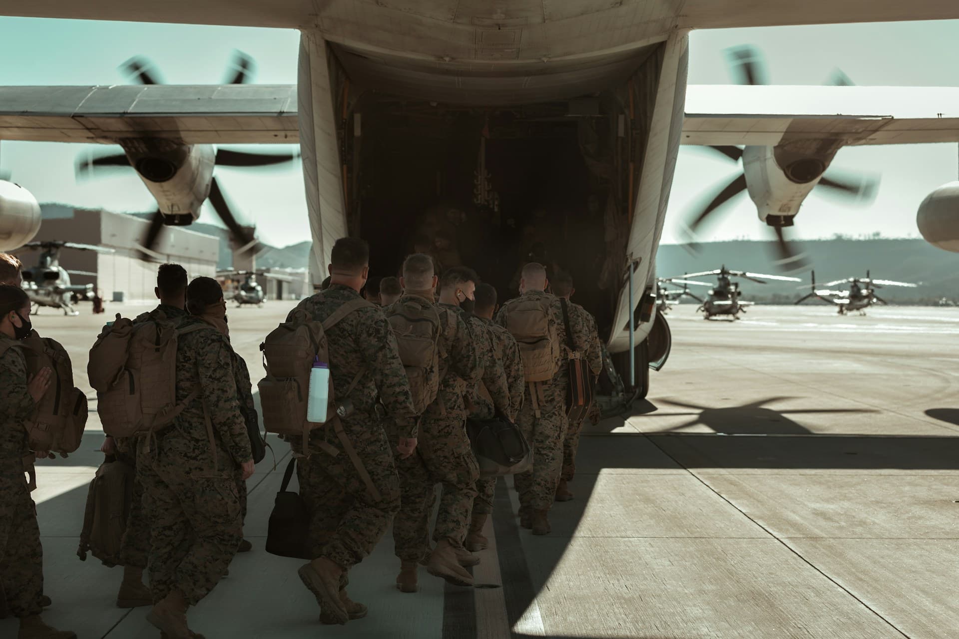 soldiers boarding a plane. 