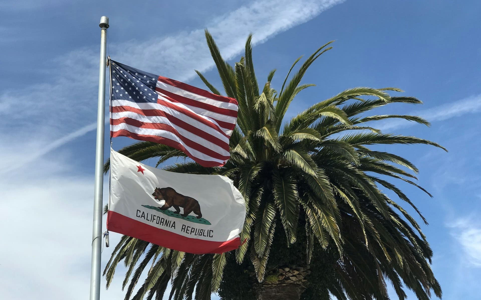 CA flag and American flag.